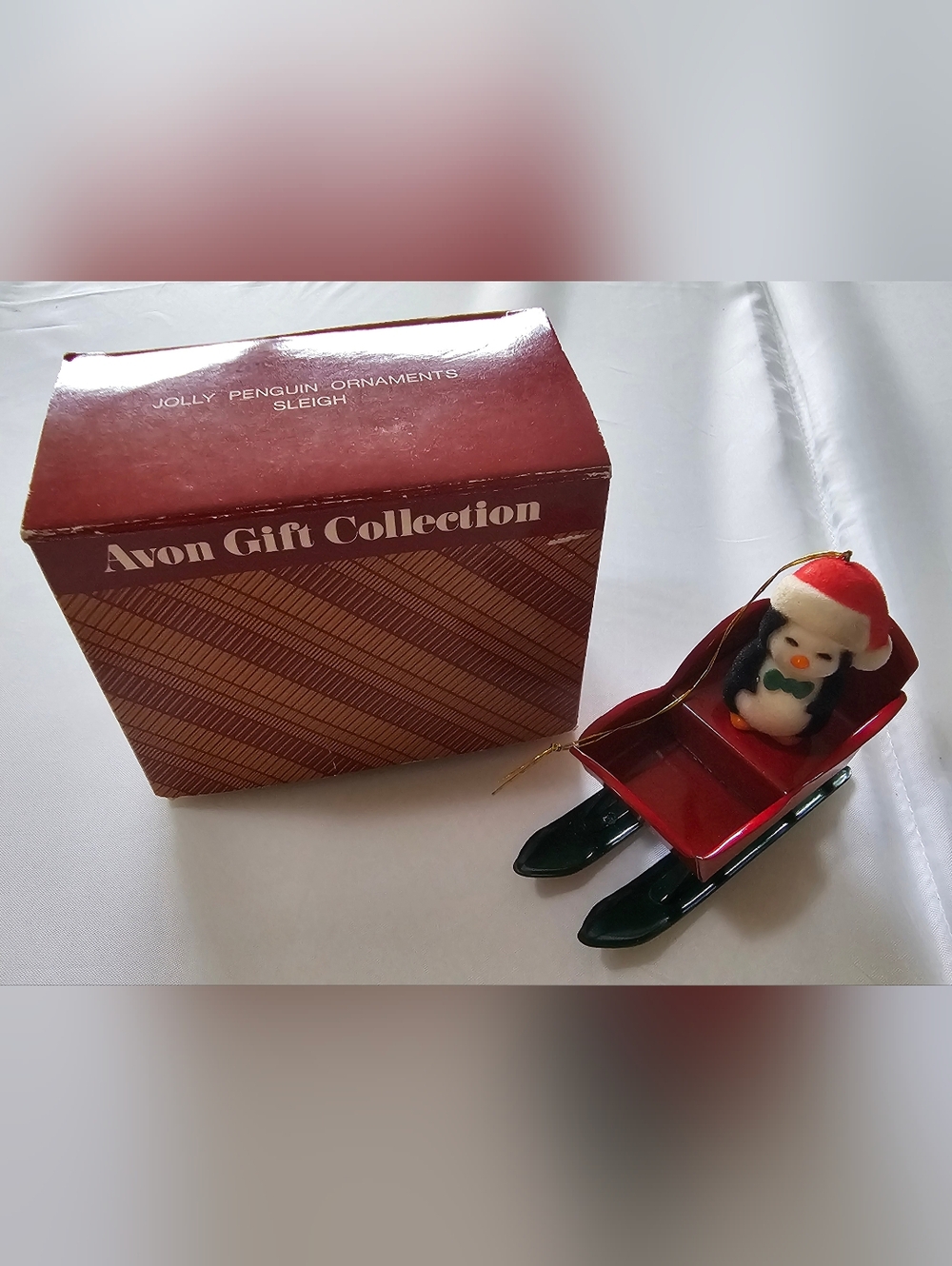 Avon Red Sleigh with Penguin Ornament